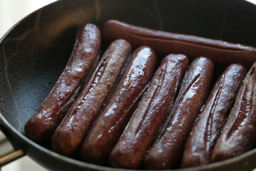 Close-up view of fried sausages. Meat fish. Cooking food. High quality photo