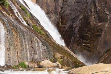 Water cascading over a small lake