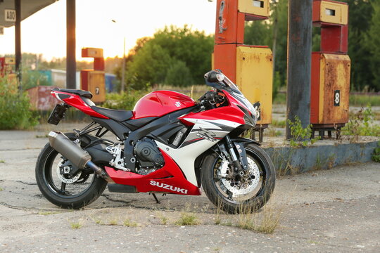 Stupino-Russia - AUGUST 14, 2021 red motorcycle Suzuki GSX-R 600 is at an abandoned old gas station