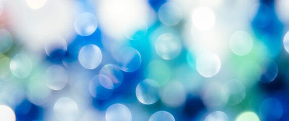 Obraz premium Bright blue-green abstract defocused background, round bokeh.