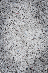Gray textured concrete background with vignetting and copy space.