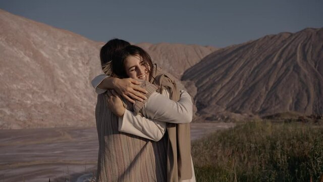 Mary hugs Jesus after parting. Strong hugs. Touching moment. High quality 4k footage
