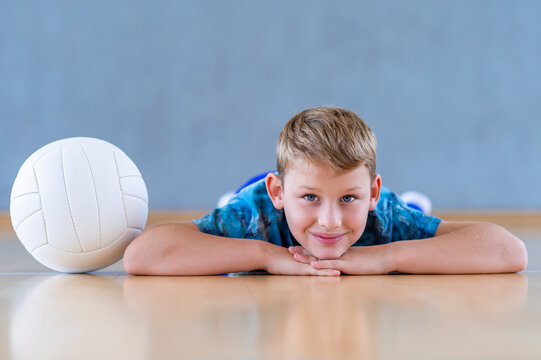 School kid playing volleyball in a physical education lesson. Horizontal education poster, greeting cards, headers, website.Safe back to school during pandemic concept