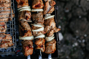 The meat is grilled on the grill. Shashlik