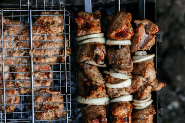 The meat is grilled on the grill. Shashlik
