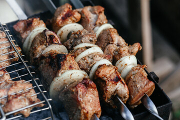 The meat is grilled on the grill. Shashlik