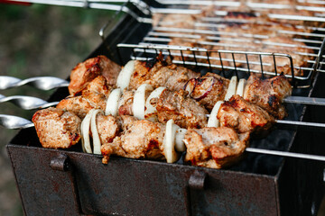 The meat is grilled on the grill. Shashlik