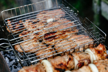 The meat is grilled on the grill. Shashlik