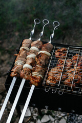 The meat is grilled on the grill. Shashlik