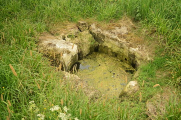 Very old Kintu water well, made of big stones. 