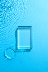 Empty glass podium with vvariour geometry shapes on blue background. Abstract nature background for...