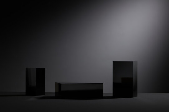 Black podium, cube minimal scene with glass geometric platform on dark background. Pedestal for display, Platform for design, concept blank scene stage showcase for new product
