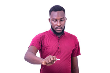 serious young man holding a key.