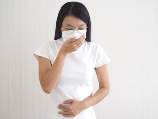 Woman suffer from sick on a white background. concept of health. closeup photo, blurred.