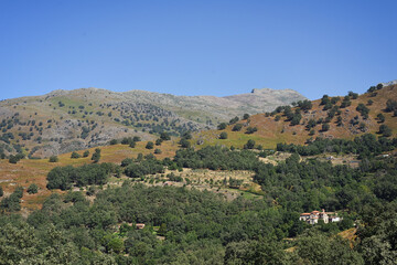 Fototapeta na wymiar View of a mountain with a lying woman and sanctuary in Candeleda, Spain.