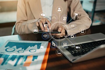 Business women hand working with tablet and laptop computer with documents on office desk.