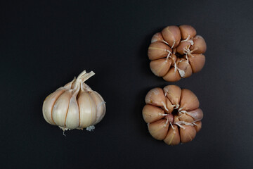 garlic placed on a black background