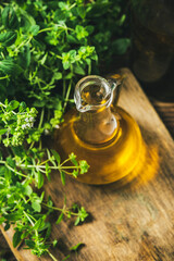 Homemade Olive Oil Infused with Fresh Oregano - obrazy, fototapety, plakaty