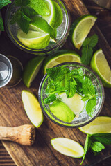 Refreshing Mojito with Ice Mint and Lime on Woodden Table