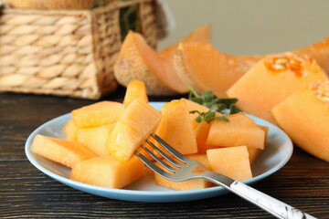 Concept of fresh food with melon pieces on rustic wooden table