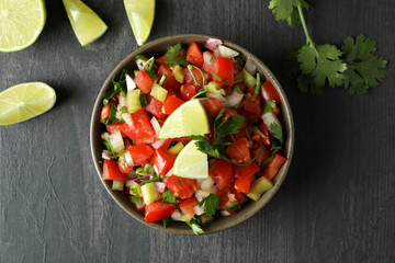 Mexican food concept with Pico de Gallo on dark wooden table