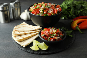 Mexican food concept with Pico de Gallo on dark wooden table
