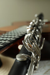 Classical guitar, clarinet and hat, close up and selective focus