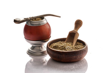 Mate yerba tea. Calabash and bombilla on white background. Traditional argentinian beverage