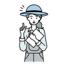 立って書類を手に持って何かひらめいた農家の女性