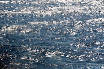 Sea foam and deep blue sea. Selective focus.