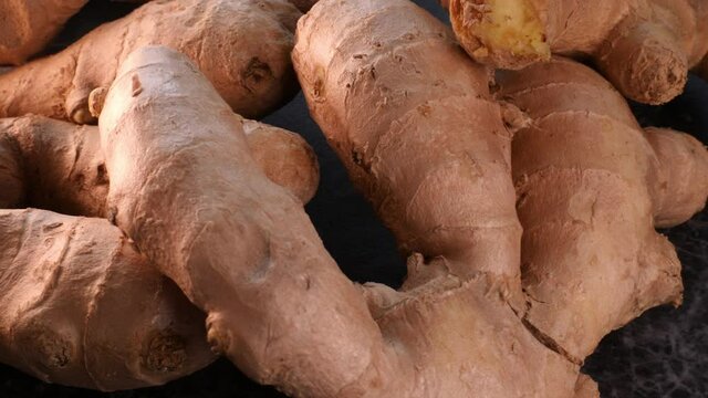 Ginger on a black background. Ginger root