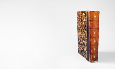 Vintage book on white background. Reading,literature,education,library,home office concept with large copy space.