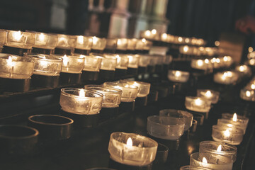 Lighted candles for ritual execution on a black background. Memorial lights in memory of the victims