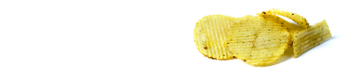 Fried potatoes, fluted chips on a white background. Copy Spac
