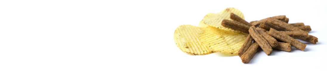 Chips and crackers on a white background. Copy Space.