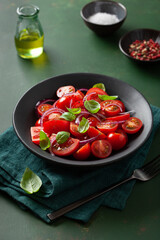 healthy tomato salad with onion basil olive oil and balsamic vinegar