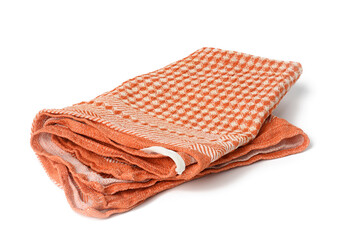 folded orange linen towel on white background