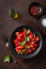 healthy tomato salad with onion basil olive oil and balsamic vinegar