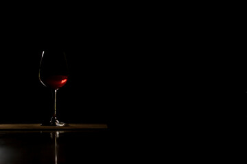 red wine glass isolated on black luxury background