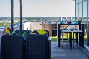 Lounge zone with hot tubon outdoor terrace in modern luxury apartment.
