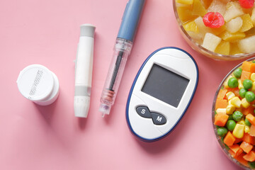 diabetic measurement tools and insulin pen and healthy food on table 