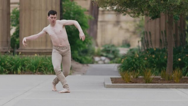 Male ballet dancer jumping and moving body in slow motion. San Francisco, USA