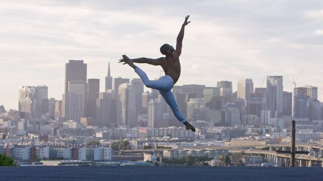 Graceful ballet dancer jumping and twirling in the air. San Francisco