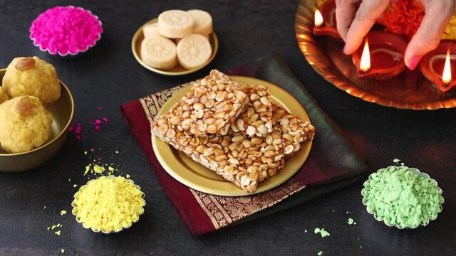 Peanut chikki candy gajak Diwali sweets Indian Sweet dessert mithai festival 4K footage video Dussehra Holi ganesh chaturthi Ram navami Durga pooja, durga ashtami Navratri Mumbai Kerala India Pakistan