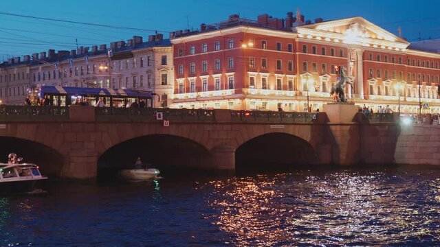Saint-Petersburg, RUSSIA - Jul 24 2021, 4k: pleasure craft in Fontanka river, view Anichkov bridge, on Jul 24, 2021 in Saint-Petersburg, Russia