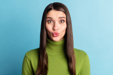 Portrait of attractive funny cheery amorous girl sending air kiss isolated over bright blue color background