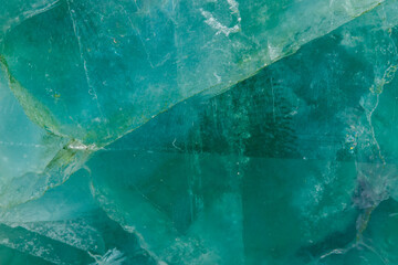 Macro mineral stone Fluorite crystal on a black background