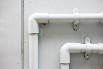 Household water supply system installed in the house. There are sewer pipes and clean water and faucets.