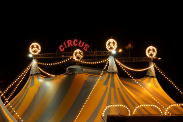 A circus tent at night with its colorful lights on © RMMPPhotography