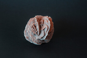 Desert rose crystal closeup photography on black background